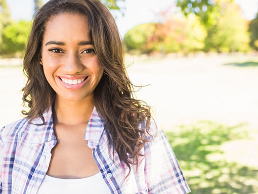 woman smiling making the OK sign