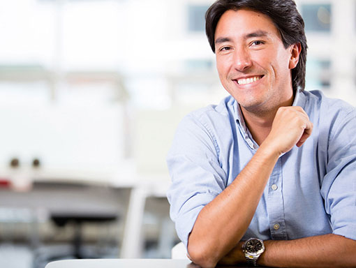 man smiling at table