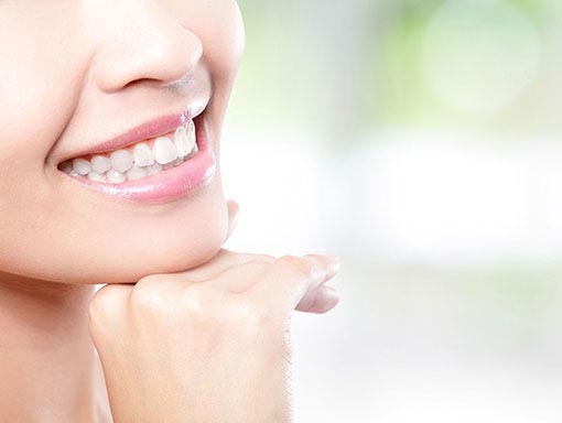 young woman with white teeth smiling